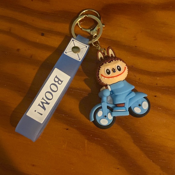 Blue LaBubu Keychain on Scooter - Picture 1 of 3